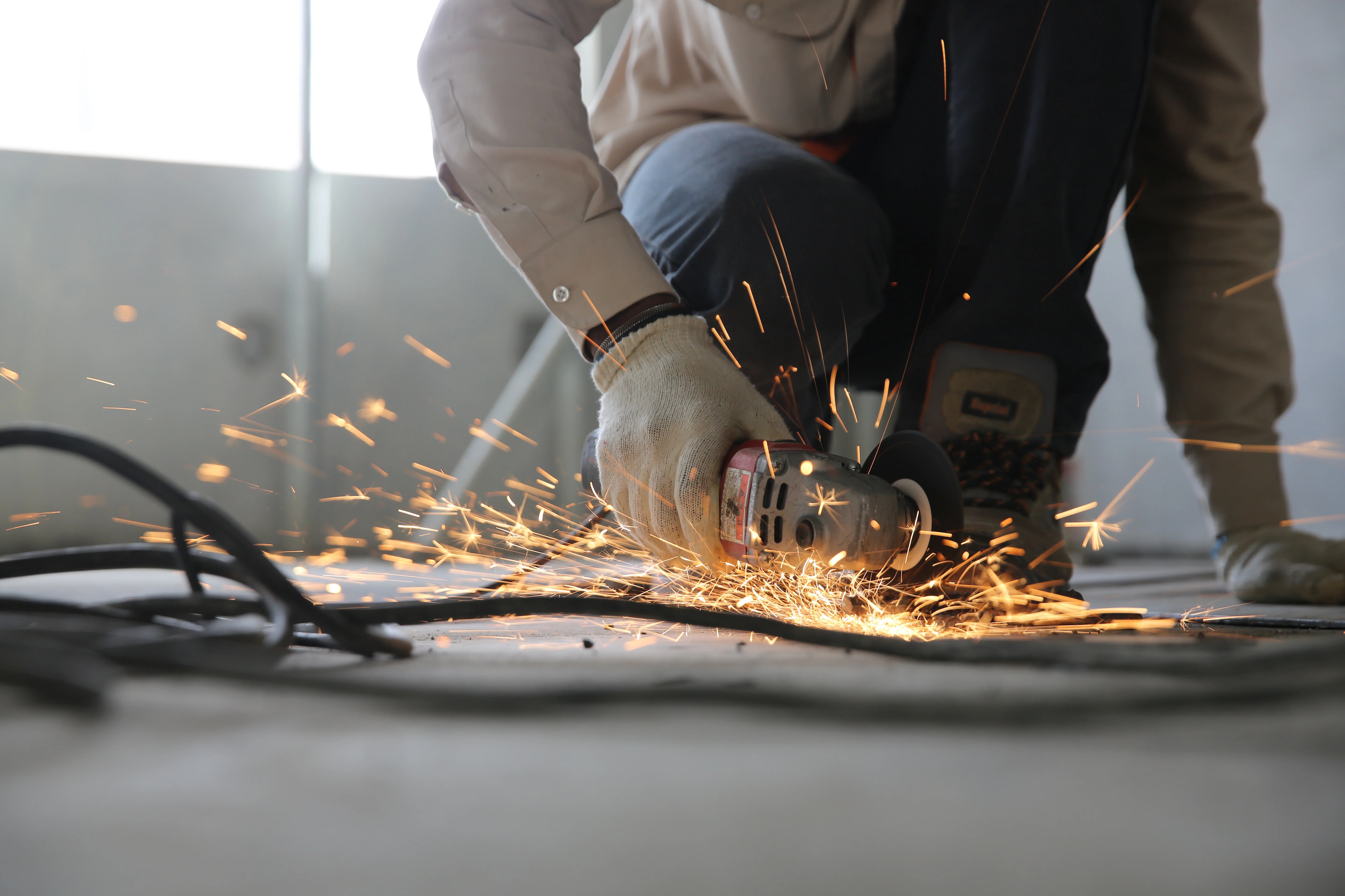 Man works with an angle grinder